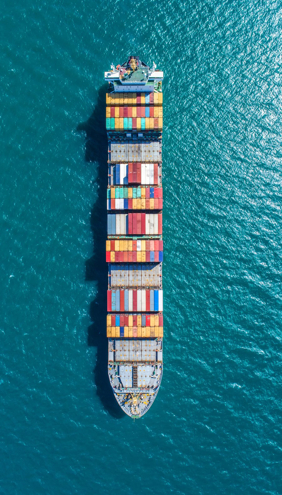 container ship in import export and business logistic.By crane ,Trade Port , Shipping.cargo to harbor.Aerial view.Water transport.International.Shell Marine.Top view.